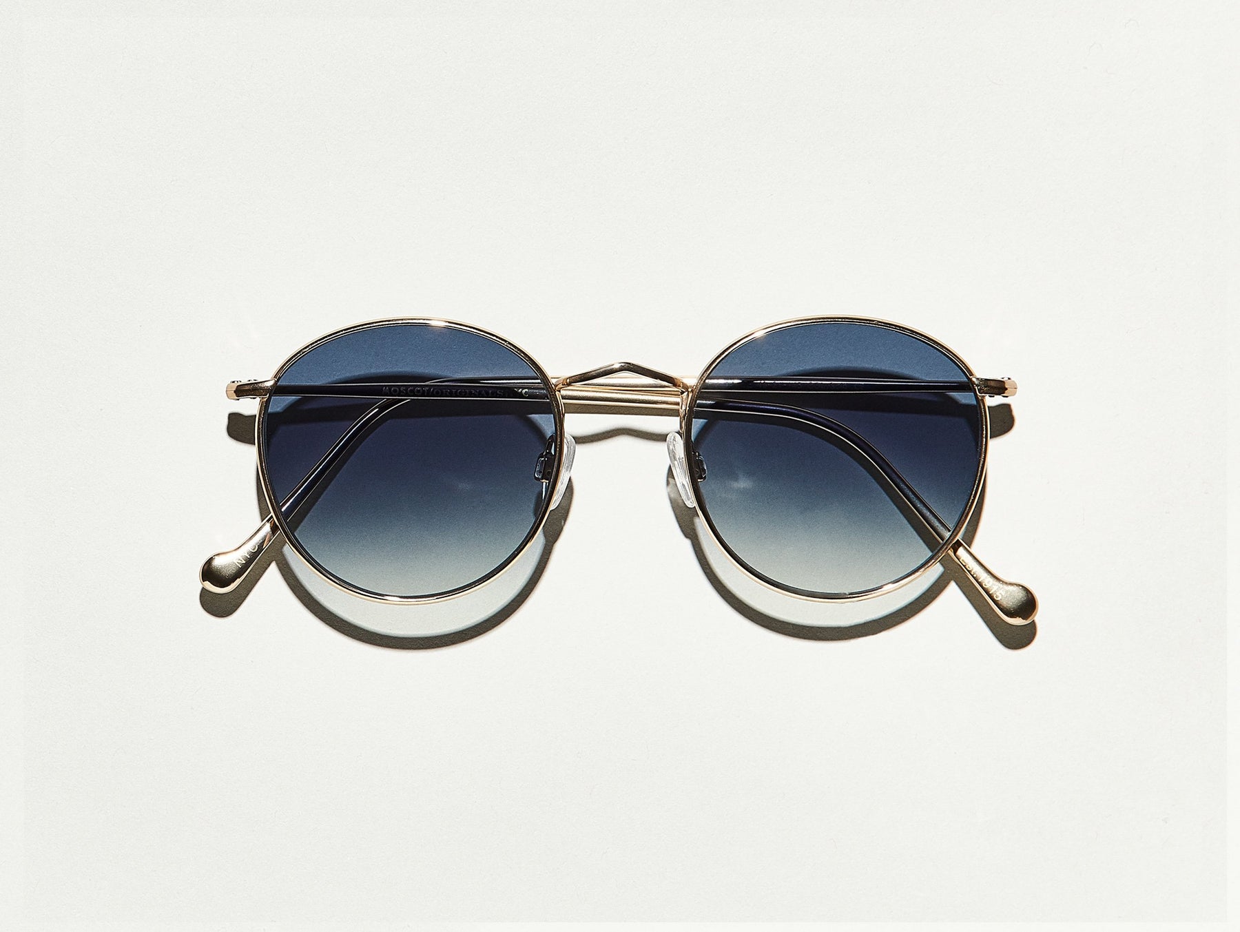 The ZEV-TT SE SUN in Gold with Navy Gradient Lenses