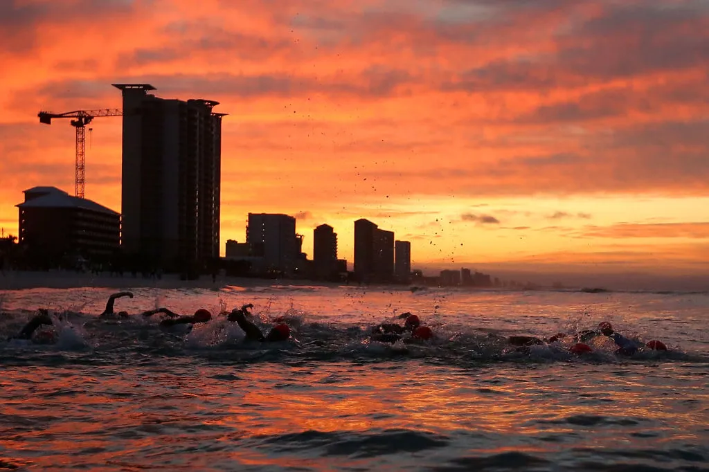 PANAMA CITY BEACH, FLORIDA - NOVEMBER 07: Athletes compete in the swim portion of the IRONMAN Florida on November 07, 2020 in Panama City Beach, Florida. (Photo by Jonathan Bachman/Getty Images for IRONMAN)