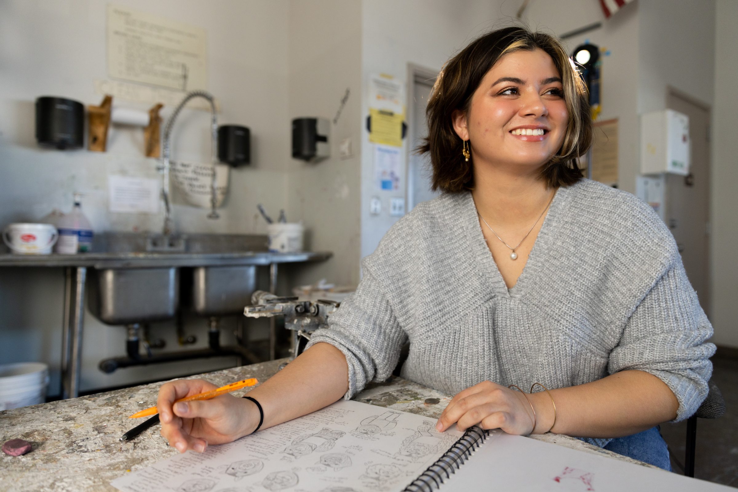 Ehsa Murray, a Studio Art student also minoring in Asian Studies and Japanese, writes in a notebook.