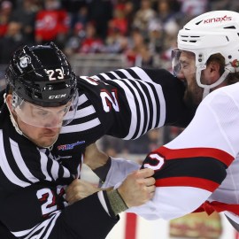 Boston Bruins forward Mark Kastelic and New Jersey Devils forward Kurtis MacDermid