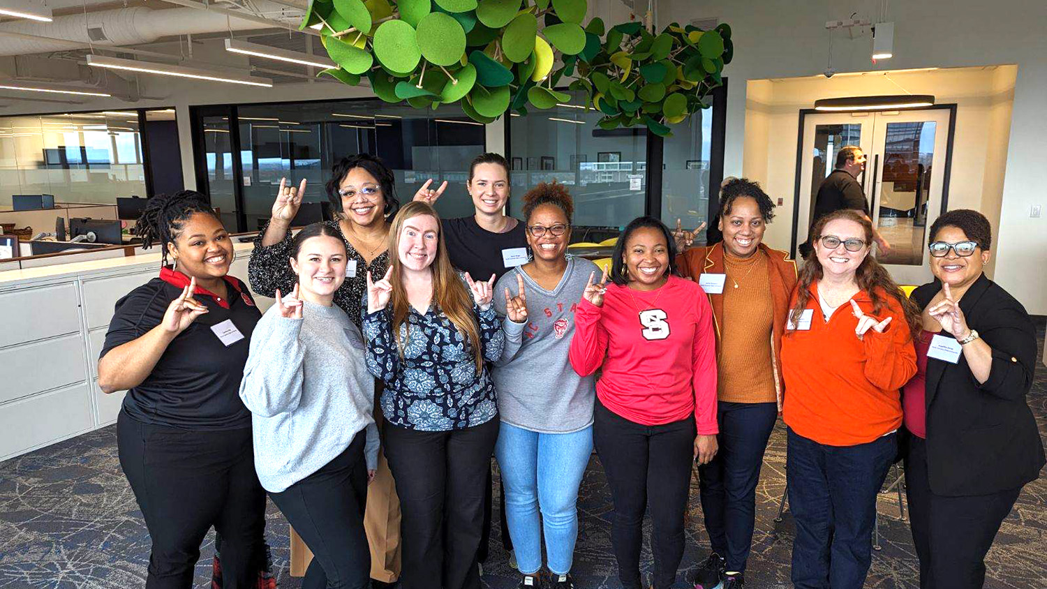 A group of faculty members poses for a photo after receiving Penn Resilience Program training.