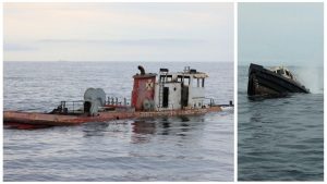 Two boats sinking in the ocean