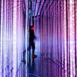 brand image - dazzling strips of light with a blurred person passing through