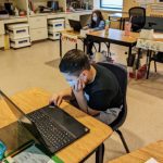 Student using a Lenovo ThinkPad in the classroom.