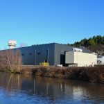 The Science and Technology Facilities Council Hartree Centre building overlooking a wide river.