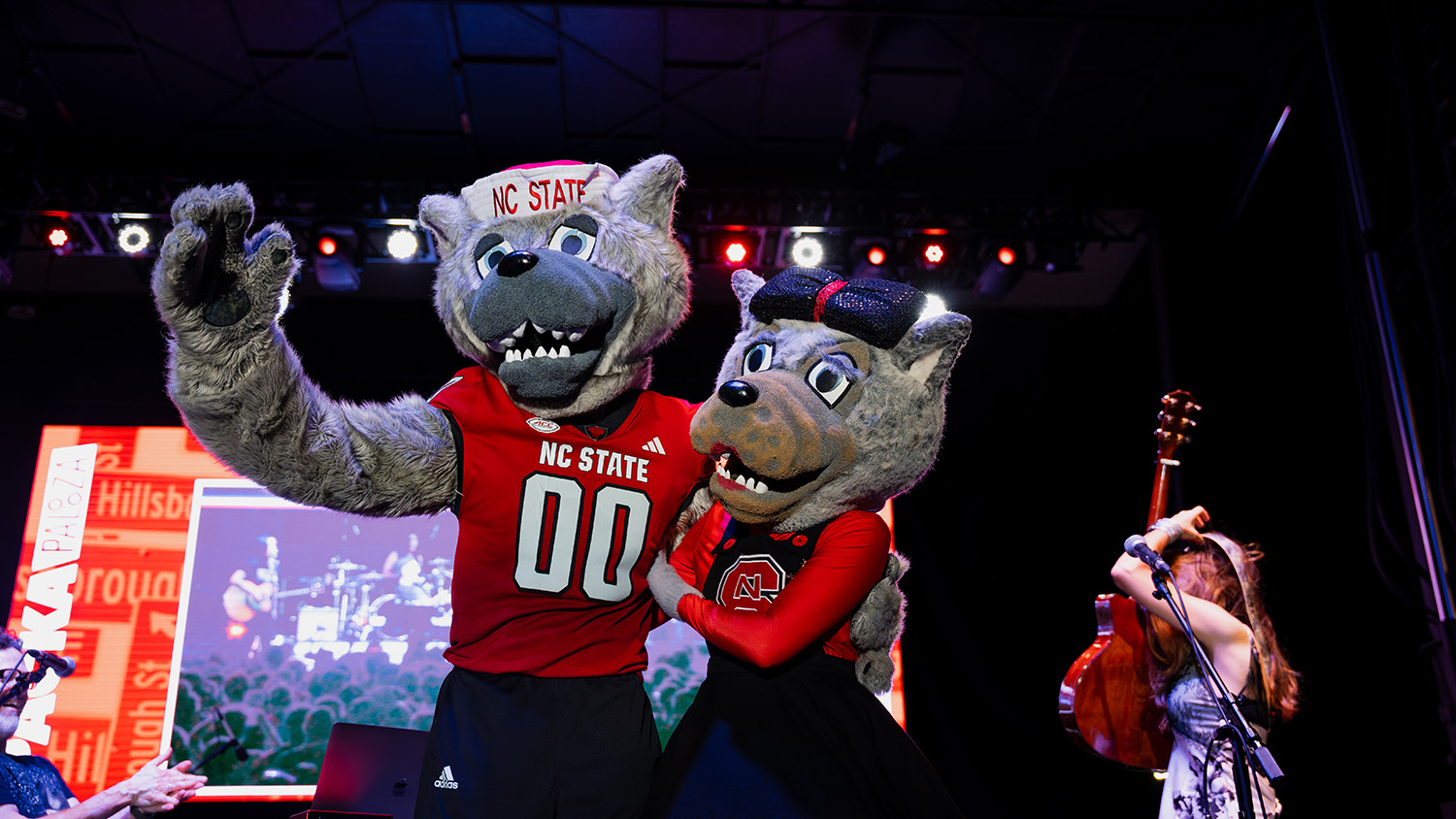 Mr. and Ms. Wuf join band The Rescues on stage at Packapalooza.