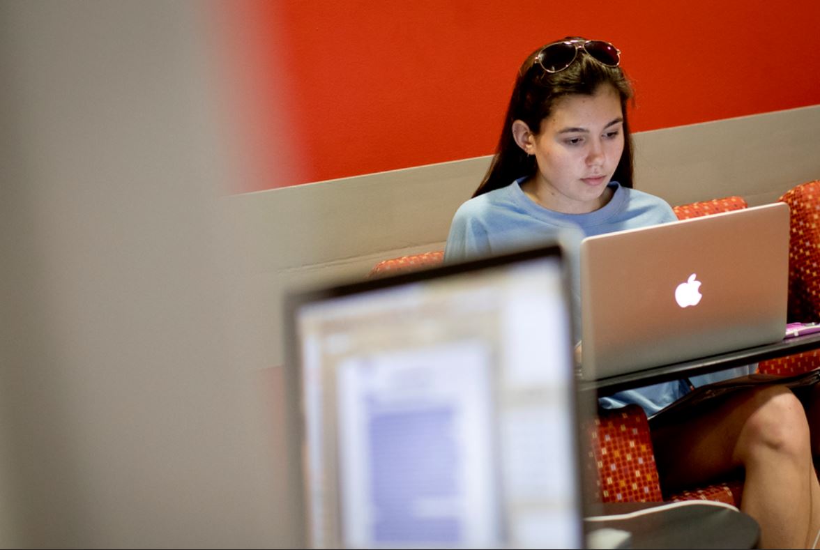  a student using social media at the TECH center