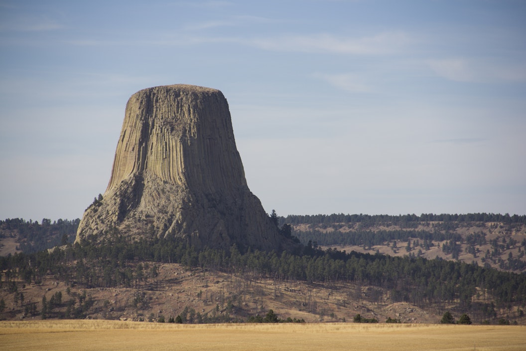 A stone tower looms over a desert landscape