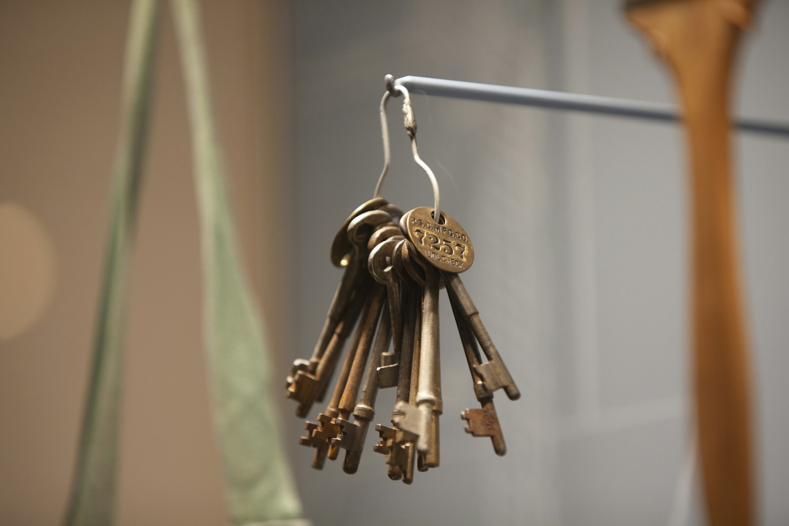 Behind glass, a ring of vintage keys