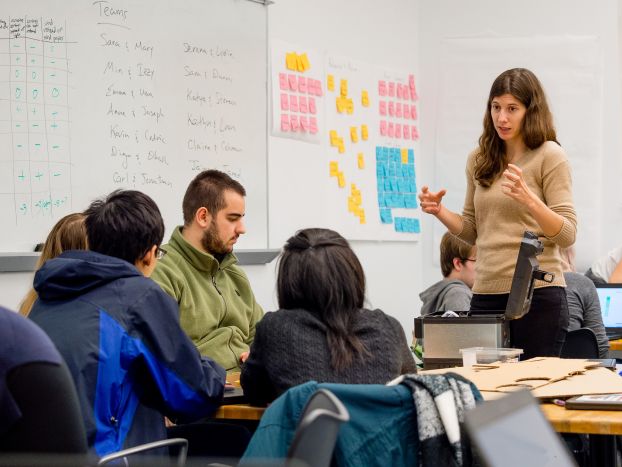 A teacher speaking to a classroom of students