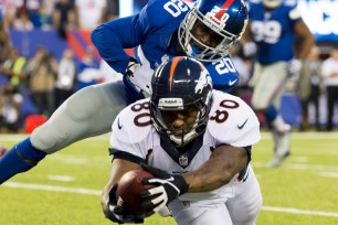 Broncos tight end Julius Thomas (80) scores a touchdown after beating Giants cornerback Prince Amukamara.