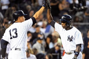 Alex Rodriguez congratulates Alfonso Soriano on a home run