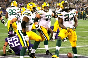 Eddie Lacy (right) and the Packers celebrate a touchdown in their win over the Vikings on Sunday night.