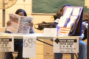 Workers looking bored during polling for the NYC Public Advocate Democratic runoff.