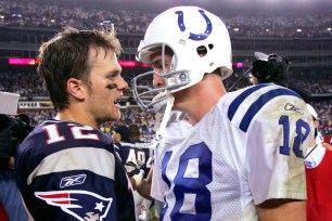 Tom Brady and Peyton Manning embrace after the Patriots beat the Colts in 2004. Brady is 10-4 against Manning in his career.