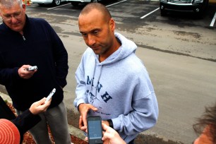Derek jeter talks to reporters after working out at the Yankees spring training complex.