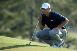 Jordan Spieth of the United States lines up a putt on the 17th green during the third round of the 2014 Masters Tournament at Augusta National Golf Club on April 12, 2014 in Augusta, Georgia.