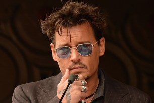 HOLLYWOOD, CA - JUNE 24: Actor Johnny Depp speaks as Jerry Bruckheimer is honored on the Hollywood Walk Of Fame on June 24, 2013 in Hollywood, California. (Photo by Mark Davis/Getty Images)