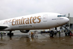 A Boeing 777-300ER aircraft of UAE carrier Emirates is in parking position at a finger of Taoyuan International Airport near Taipei, Taiwan.