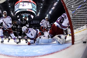 Mike Richards celebrates as the Rangers give up the game-winner in overtime on Wednesday.