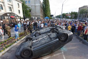 Protesters hold a rally near the Russian embassy in Kiev June 14, 2014.