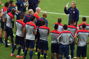 Juergen Klinsmann speaks to his US squad at a training session at the Estadio Arena das Dunas on Sunday in Natal, Brazil.