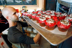 A Crumbs employee totes treats at the Beverly Hills shop's 2007 opening. The chain abruptly shut on Tuesday after being delisted from the Nasdaq on Monday.