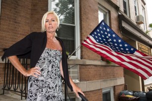 Karen Burke Abruzzese stands outside her home, where her American Flag was stolen in Windsor Terrace.