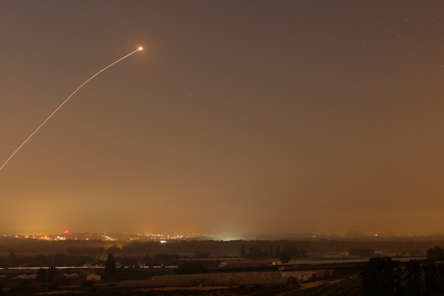 An interception by the Iron Dome anti-missile system is seen as rockets are launched from Gaza towards Israel before a 72-hour ceasefire was due to expire August 13, 2014. At least two rockets fired from the Gaza Strip struck Israel on Wednesday, moments before a three-day truce was set to expire, police said. Spokesman Micky Rosenfeld said two rockets landed in open areas causing no damage or casualties. The attacks occurred as Palestinians announced agreement to extend a truce expiring at 2100 gmt Wednesday for another five days. REUTERS/Amir Cohen (ISRAEL - Tags: POLITICS CIVIL UNREST MILITARY CONFLICT TPX IMAGES OF THE DAY)