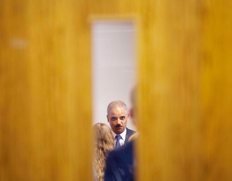 Attorney General Eric Holder is pictured during his closed-door meeting with students at St. Louis Community College Florissant Valley in Ferguson, Missouri August 20, 2014. Holder visited Ferguson, Missouri, on Wednesday, hours after nearly 50 protesters were arrested in the 11th straight night of demonstrations over the August 9 fatal shooting of Michael Brown, an unarmed black teenager, by a white police officer. The St. Louis County prosecutor's office will also begin presenting evidence on Wednesday to a regularly seated grand jury investigating the shooting death of Brown. REUTERS/Pablo Martinez Monsivais/Pool (UNITED STATES - Tags: POLITICS CRIME LAW CIVIL UNREST)