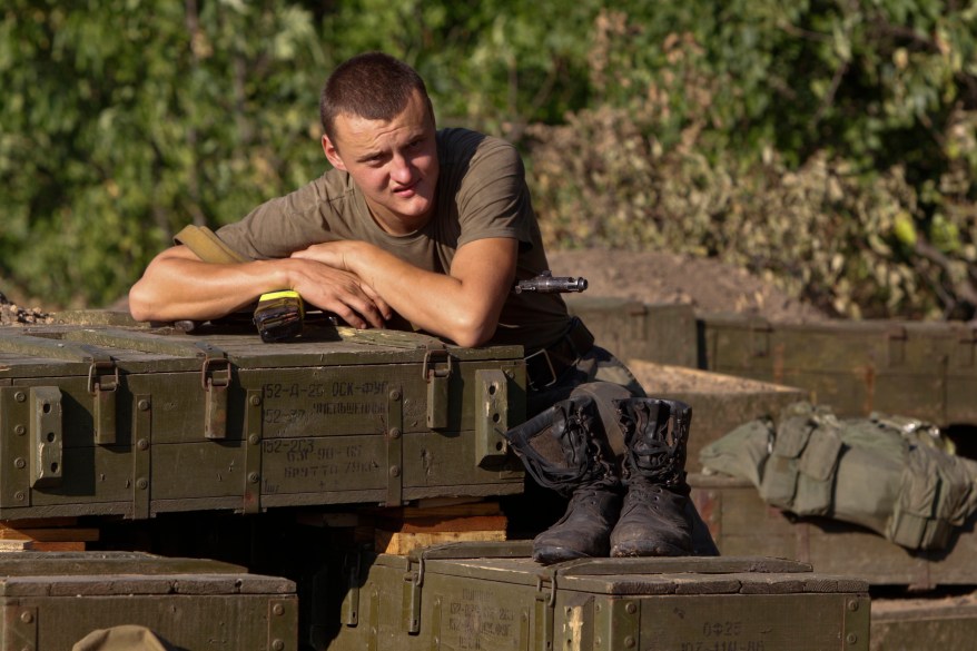 A Ukrainian serviceman rests at a military camp in Luhansk region August 20, 2014. REUTERS/Valentyn Ogirenko (UKRAINE - Tags: CONFLICT CIVIL UNREST)