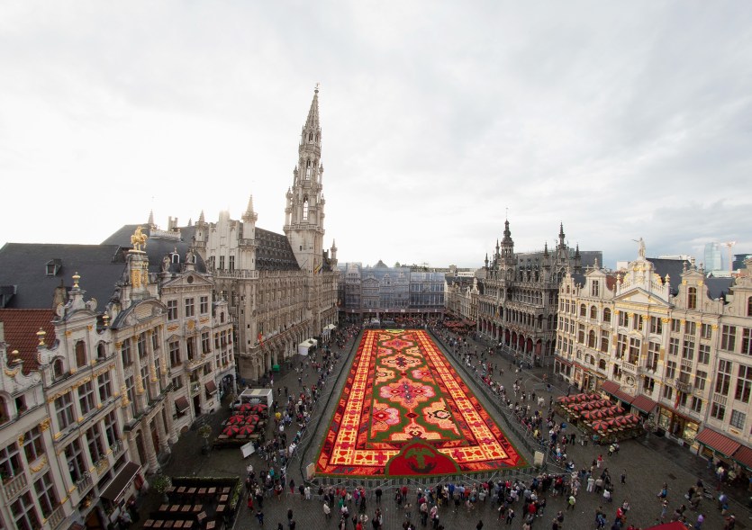 BRUSSELS, BELGIUM - AUGUST 14: A giant flower carpet is pictured at the Grand Place next to the town hall on August 14, 2014 in Brussels, Belgium. This year nearly 750,000 begonias were needed to decorate on 1800 square meter the flower carpet. (Photo by Andreas Rentz/Getty Images)