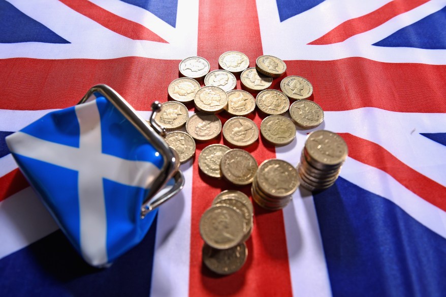 GLASGOW, SCOTLAND - AUGUST 20: In this photo illustration, pound coins are placed on a Union Jack flag on August 20, 2014 in Glasgow, Scotland. First Minister Alex Salmond's, chief economic adviser has insisted Scotland has viable options for its currency if there is a yes vote in the independence referendum on September the18th. (Photo by Jeff J Mitchell/Getty Images)