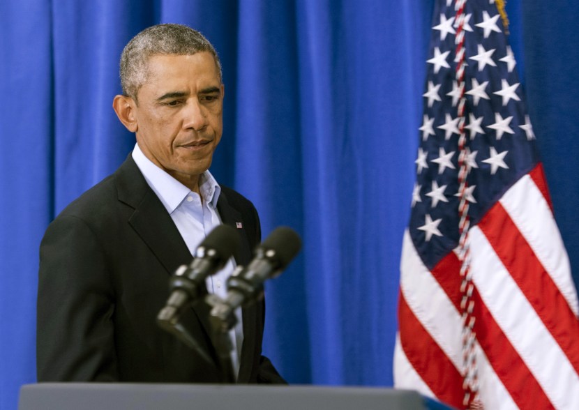 EDGARTOWN, MA - AUGUST 20: (AFP OUT) U.S. President Barack Obama arrives to make a statement about the execution of American journalist James Foley by ISIS terrorist in Iraq during a press briefing at the press filing center at the Edgartown School August 20, 2014 in Edgartown, Martha's Vineyard, Massachusetts. In a video released shows an ISIS militant beheading Foley in what is believed to be retaliation for U.S. airstrikes in Iraq. The militant then threatens the life of another American hostage, Steven Sotloff, who is also missing. (Photo by Rick Friedman-Pool/Getty Images)