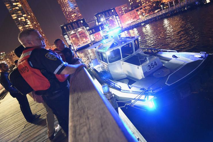 Police rescue multiple people from the East River on August 25.