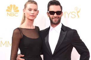 Behati Prinsloo and Adam Levine arrive at the Emmy Awards on Aug. 25.