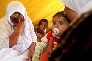 Yazidi refugees gather in a tent a Newroz camp in north eastern Syria August 14th.