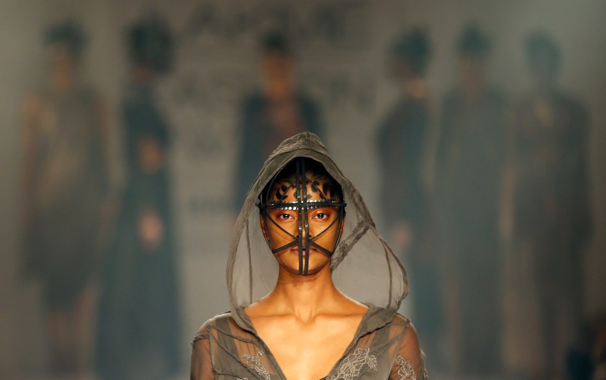 A model displays a creation by a Gen Next designer during the first day of the Lakme Fashion Week in Mumbai, India, Wednesday, Aug. 20, 2014. (AP Photo/Rajanish Kakade)