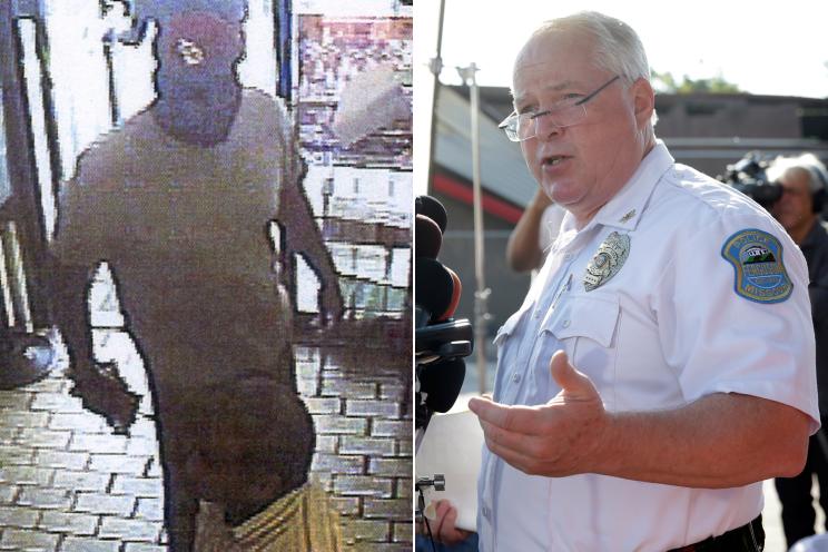 Police Chief Thomas Jackson (right) announces the name of the Ferguson police officer responsible for the August 9 shooting death of teenager Michael Brown on August 15.