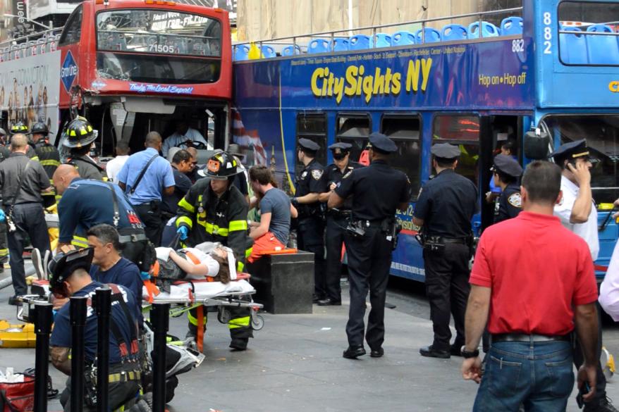 The scene where two tour buses crashed in Time Square.