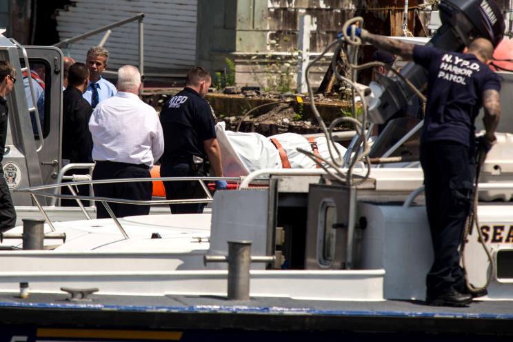 An NYPD harbor unit unloads a body — found off the coast of Canarsie — at the Fort Tilden US Coast Guard Station in the Rockaways.