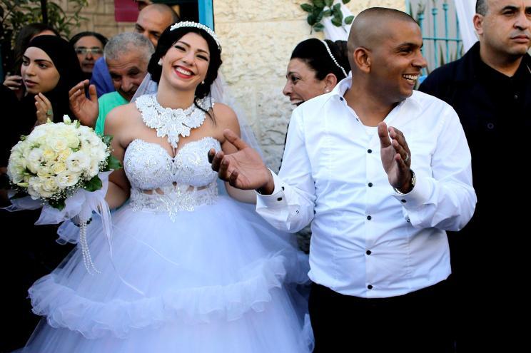 Groom Mahmoud Mansour and his bride Maral Malka celebrate with family and friends in Mahmoud’s family house in Jaffa, south of Tel Aviv.