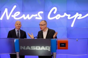 Robert Thomson, CEO of News Corp (right) and Gerard Baker, Editor in Chief of The Wall Street Journal, participate in the opening ceremonies at the Nasdaq MarketSite on July 8.