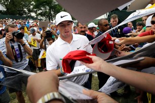 Rory McIlroy signs autographs after a practice round for the PGA Championship at Valhalla Golf Club in Louisville, Ky., on Tuesday.