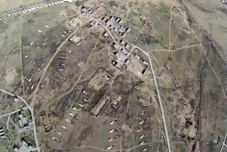 Aerial footage from an ISIS drone shot above a Syrian military field in Tabqa.