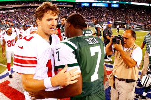 Eli Manning greets Geno Smith after Jets-Giants preseason game.