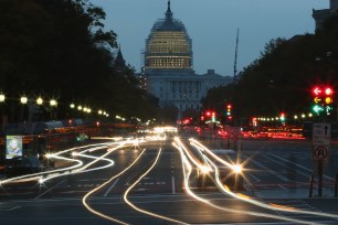 WASHINGTON, DC - NOVEMBER 05: The early morning sun rises behind the US Capitol building as traffic drives down Pennsylvania Ave., November 5, 2014 in Washington, DC. Yesterday Republicans won the majority of the US Senate for the first time in 8 years after Americans went to the polls and voted in the mid-term elections. (Photo by Mark Wilson/Getty Images)