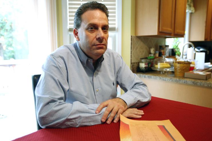 Joe Lentini poses with a copy of the receipt from Bobby Flay Steak at the Borgata.