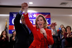 Virginia Republican Congressional candidate Barbara Comstock, right, celebrates with her husband Chip Comstock, at her election night party, Tuesday, Nov. 4.
