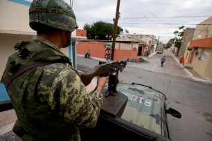 A soldier on patrol in violence violence-wracked Tamaulipas, Mexico.